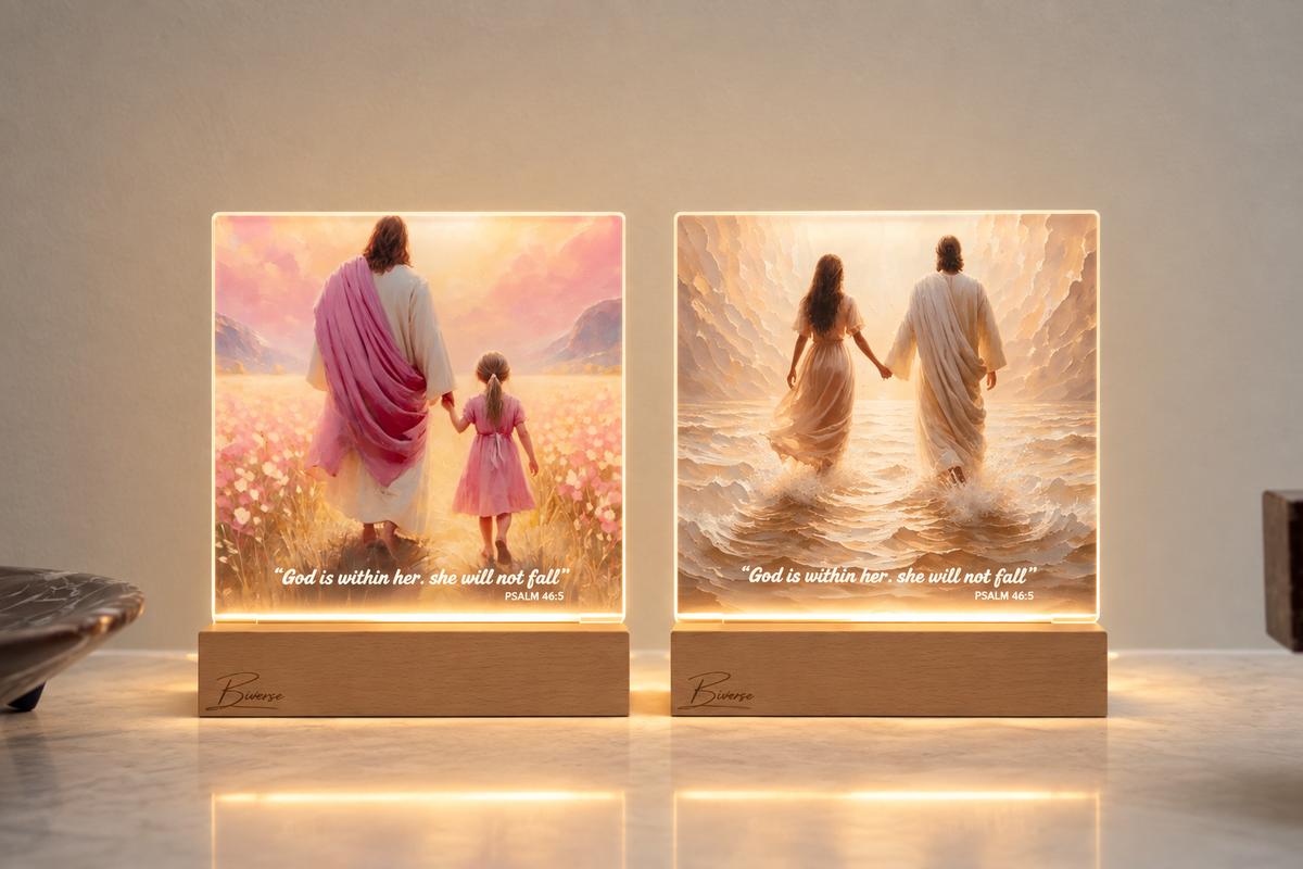 Two illuminated BIVERSE acrylic decor lamps with religious illustrations on timber bases.