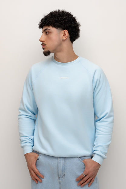 Model wearing the Sky blue BIVERSE crewneck, three-quarter front view.