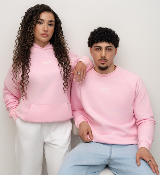 Models wearing a Candy pink BIVERSE hoodie and crewneck, front view.
