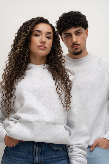 Two models wearing a light grey BIVERSE hoodie and crewneck with chest logos.