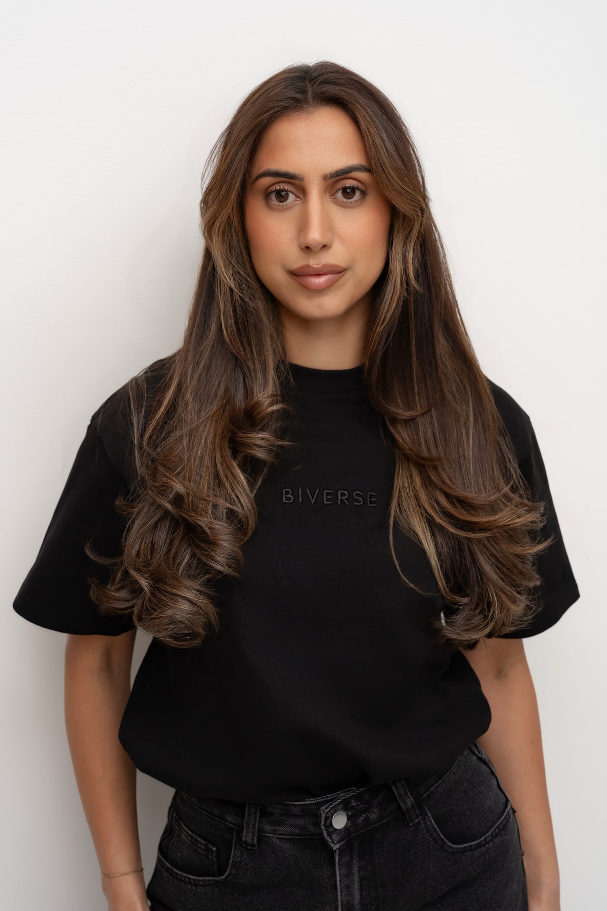 Model wearing a black Biverse tee
