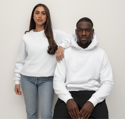 Models wearing a Snow white BIVERSE crewneck and hoodie, seated studio portrait.