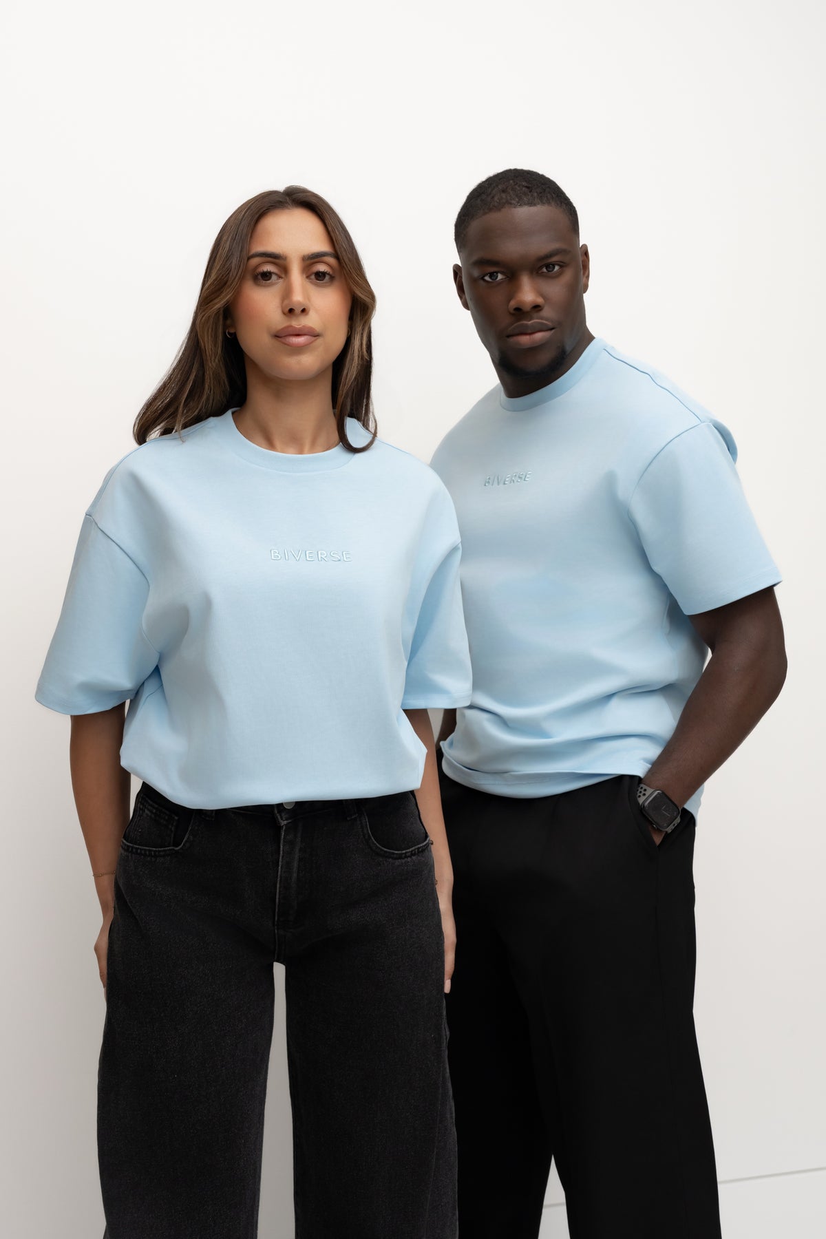 Two models wearing Sky blue BIVERSE tees in a studio.