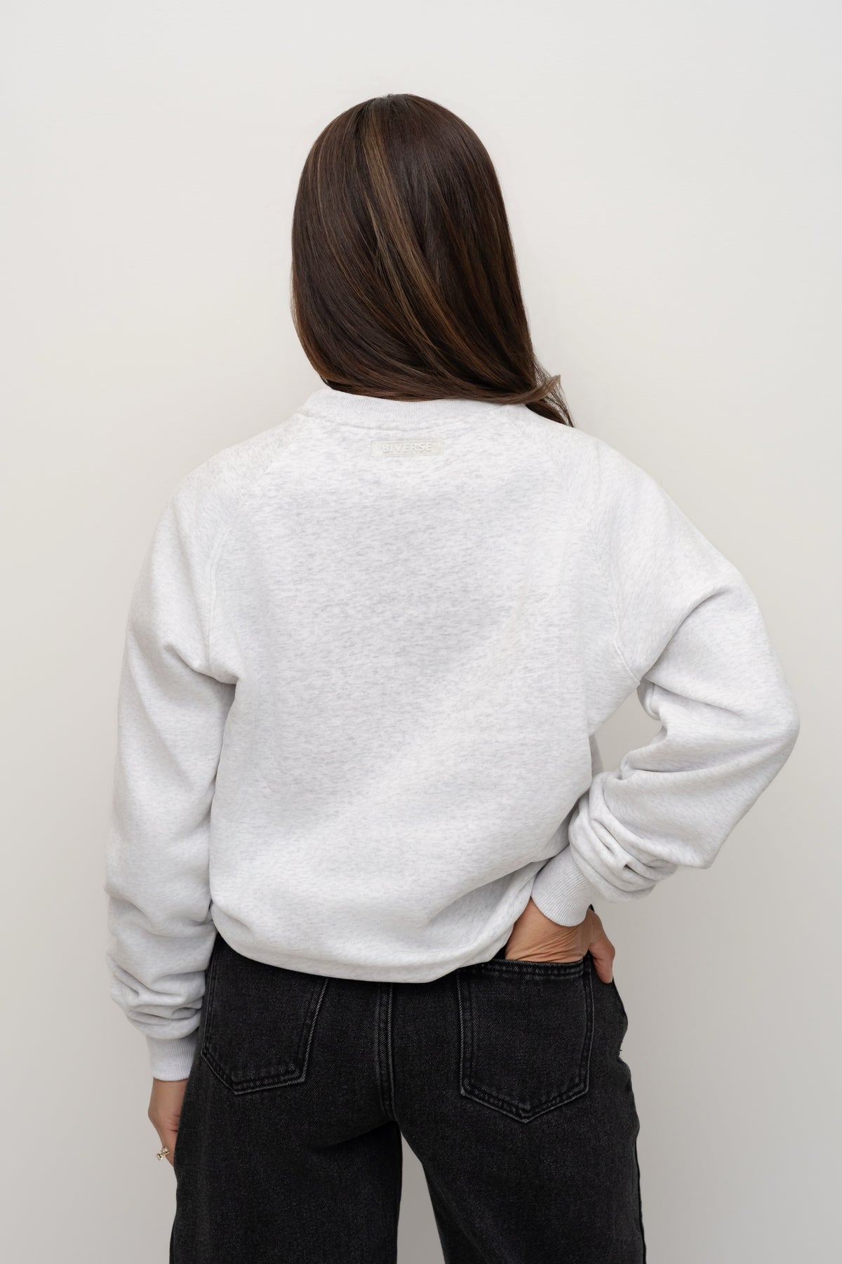 Back view of the Smoke light grey BIVERSE crewneck on a model.