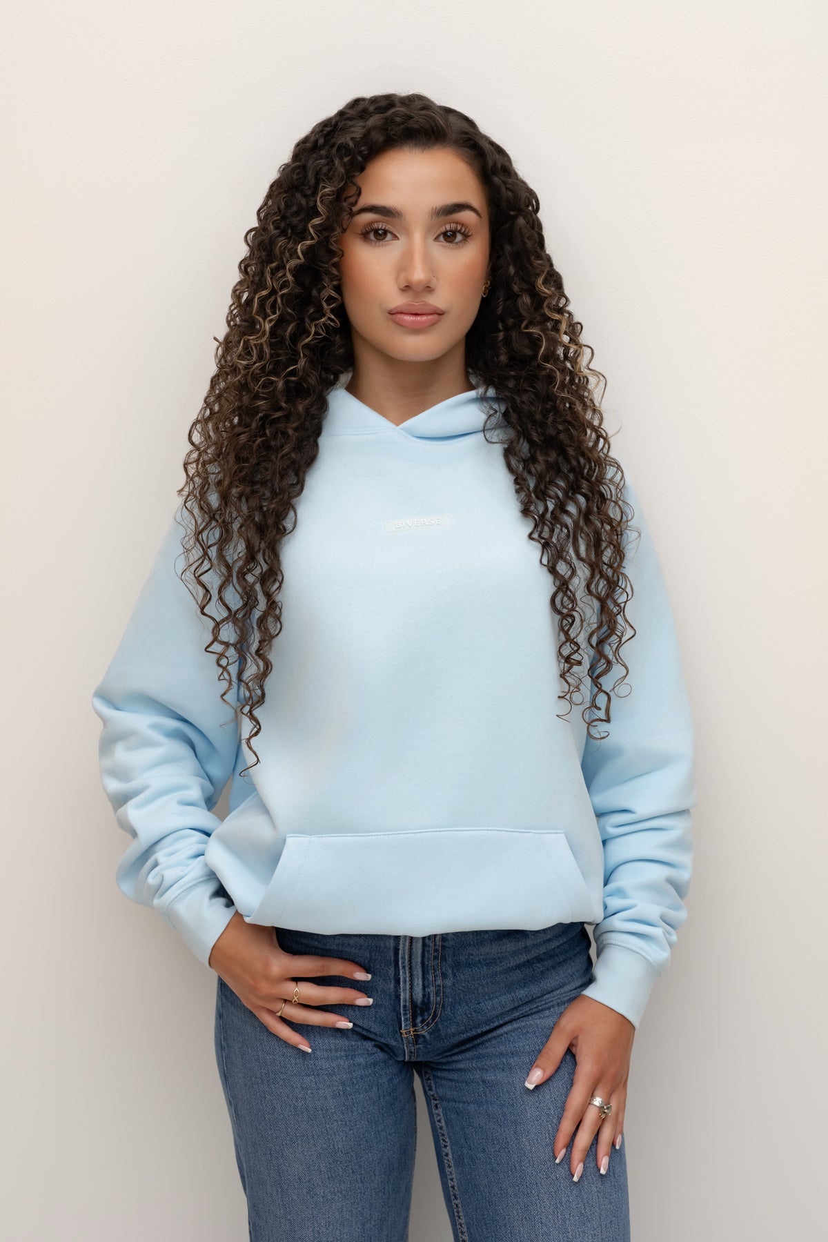 Model wearing a blue Biverse hoodie