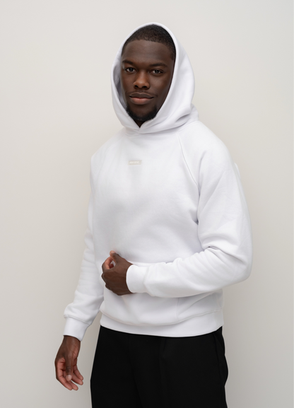 Model wearing the Snow white BIVERSE hoodie with the hood up, side view.