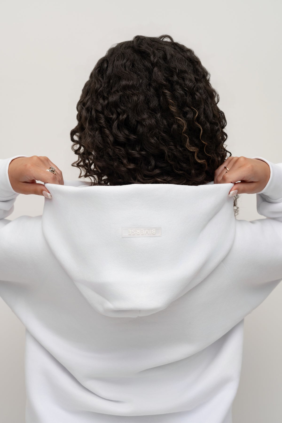 Back view showing the hood detail on the Snow white BIVERSE hoodie.