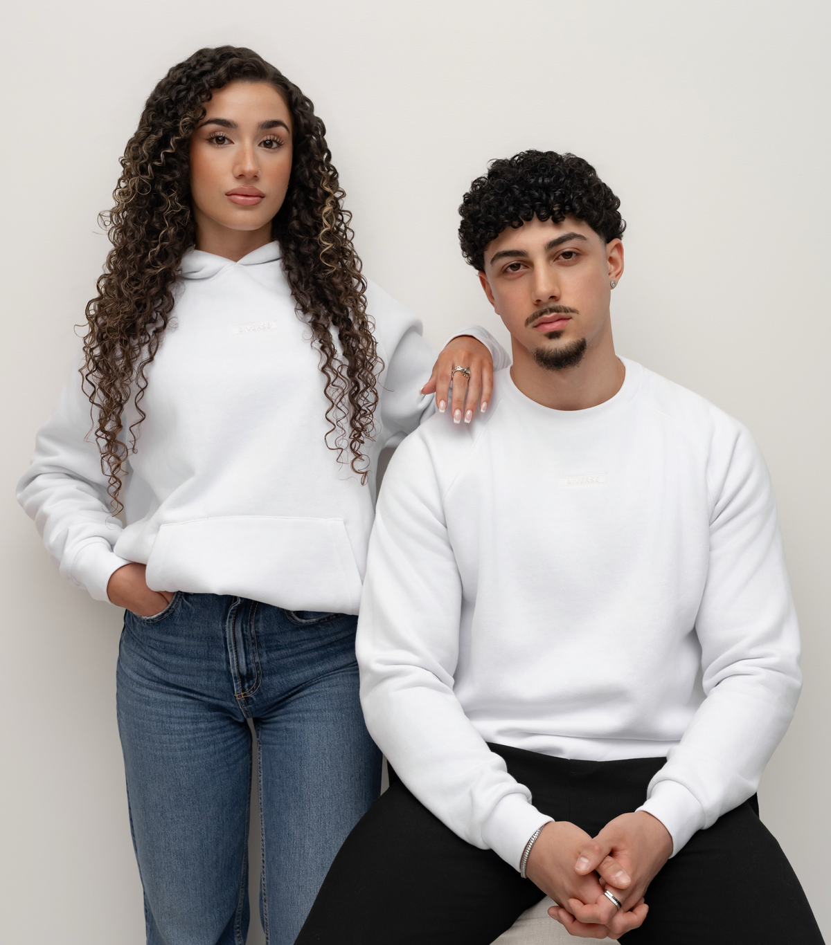 Models wearing a Snow white BIVERSE hoodie and crewneck.